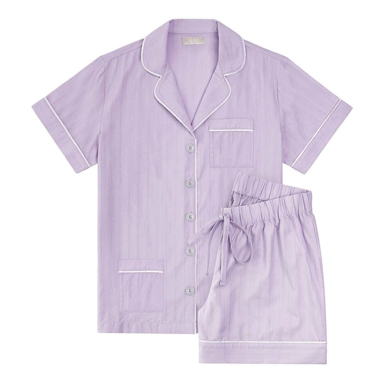 A lilac cotton pyjama set by Kip for an article about how to curate a cozy night in.