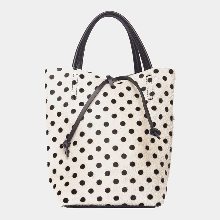 A white and black polka dot leather bag from Maguire to illustrate the polka dot trend.