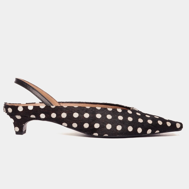 A black and white pony hair polka dot kitten-heeled mule from Maguire to illustrate the polka dot trend.
