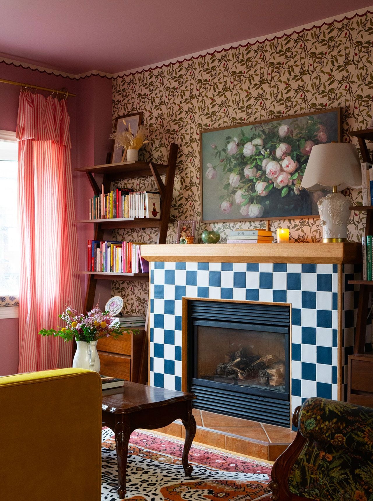A wallpaper trip and fringed sofa in a maximalist living room by decor expert Alexandra Gater for an article about easy DIY home decor projects.