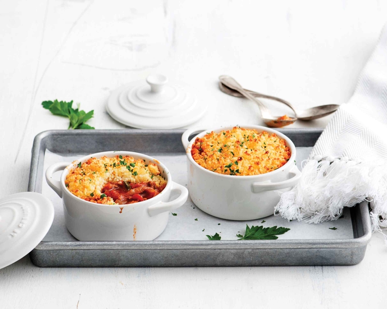 Individual servings of Moroccan Shepherd’s Pie with a crispy couscous topping and fresh parsley. A healthy, modern take on a comfort food classic, perfect for meal prep or dinner parties.