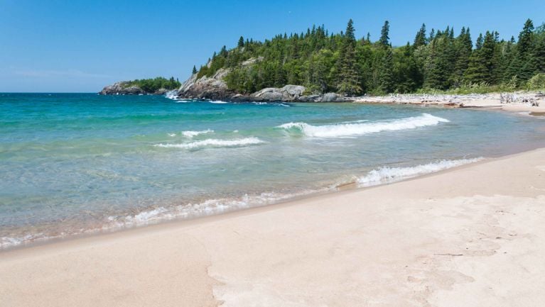 An image of a white sandy beach at Pukaskwa National Park in northwestern ontario, used in a post on Canada Strong Pass 2026.