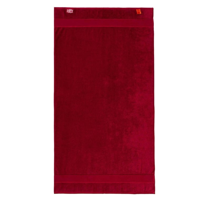 A Typical Classic Bath Towel in a rich velvet-like red colour for an article about the best purchases editors picked for April 2026