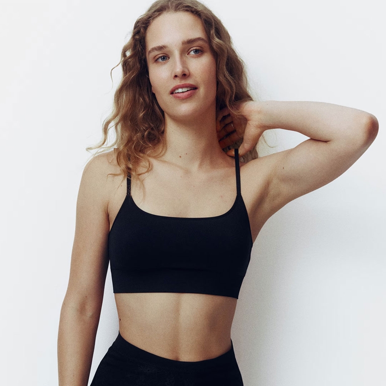 A model wearing a H&M bralette for an article about how Drew Barrymore hates bras.