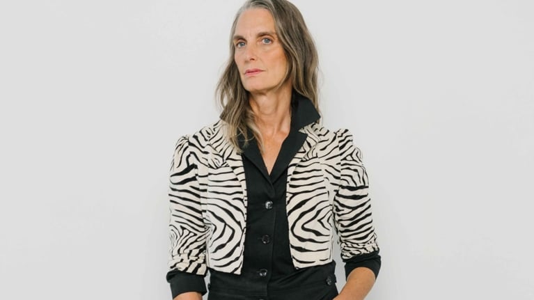A photo of a woman in a black jumpsuit and leopard bolero jacket in a post about Horses Atelier closing.