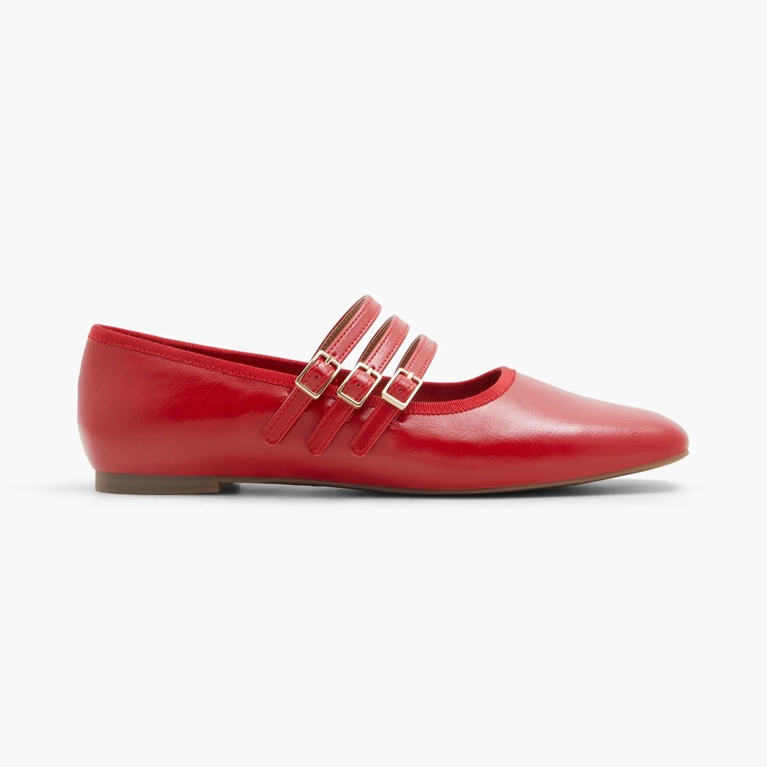A pair of red Call It Spring Mary Jane shoes.