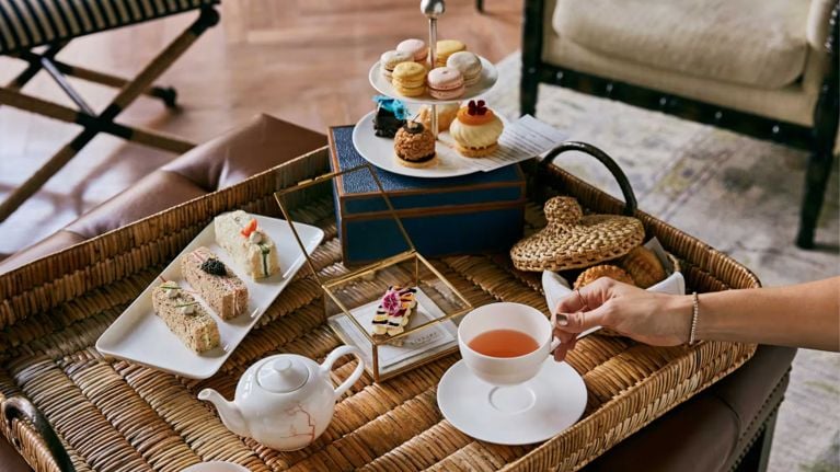 A high tea service complete with finger sandwiches and petits fours as part of a rosewood baha mar review.