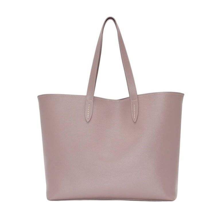 A Roots Carryall Tote Cervino bag in the shade Taupe for an article about 13 structured tote styles that do it all