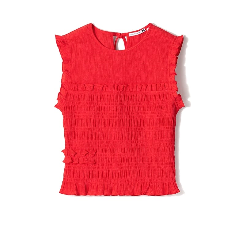 A red shirred tank against a white background for an article about the Uniqlo Cecilie Bahnsen Spring-Summer 2026 collection.