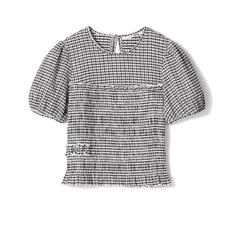 A black and white gingham shirred top against a white background for an article about the Uniqlo Cecilie Bahnsen Spring-Summer 2026 collection.