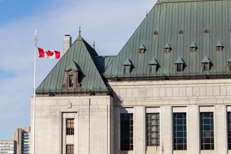 Supreme Court of Canada building with flag, used in a post about