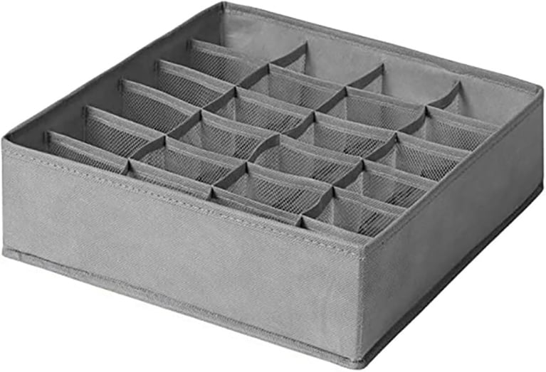 A grey mesh square sock divider insert for a drawer.