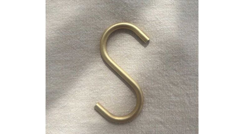 A brass S hook used in a post about best organizing tips.