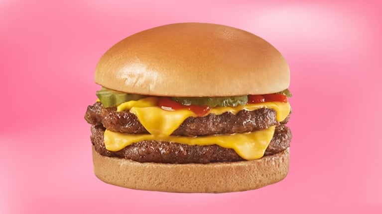 A double cheeseburger on a pink background in a post about $5 meal deals.