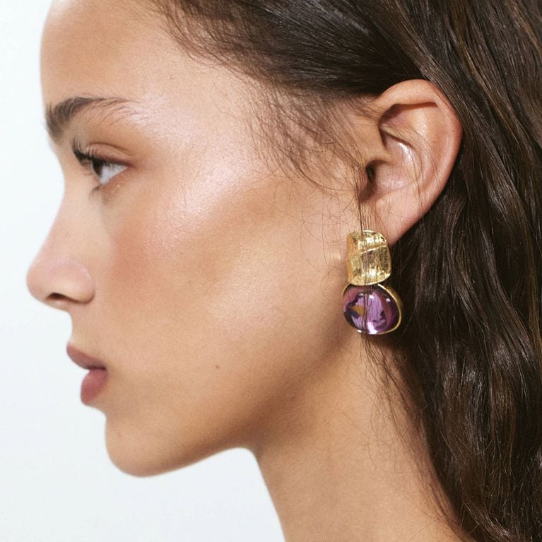 Gold and purple resin earrings from the Hailey Bieber Mango collection.