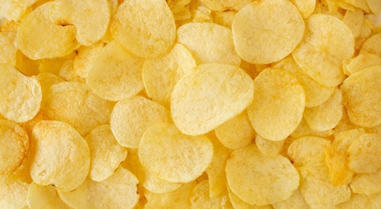 A close-up of plain potato chips used in a post about the covered bridge lawsuit.