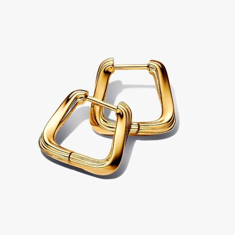 A pair of gold Pandora Essence Twisted Triangle Small Hoop Earrings for an article about the best Mother's Day gifts.