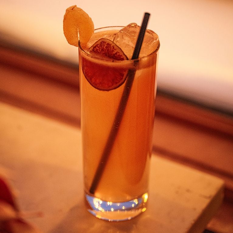 A tall glass of a ginger beer and rum cocktail for a story on Heated Rivalry-themed drinks at Le Tambour Tavern.