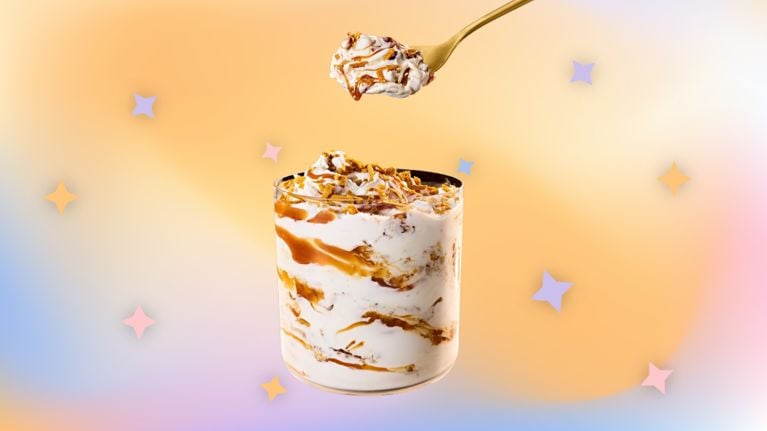 golden mcflurry from mcdonalds with a multi-coloured background with four-point stars for an article taste test