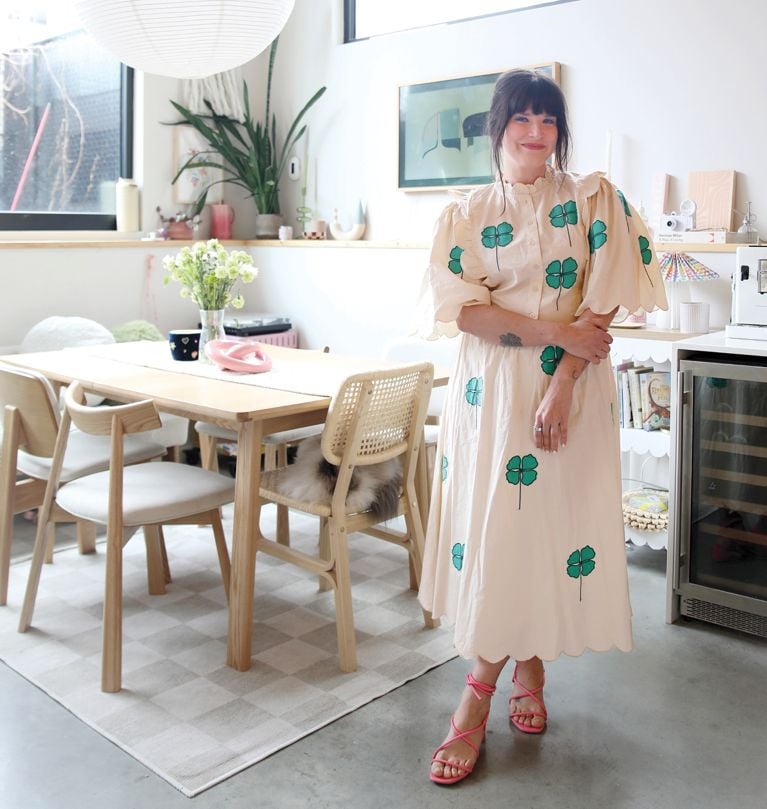 Maca Atencio in her kitchen wearing her whimsical summer style