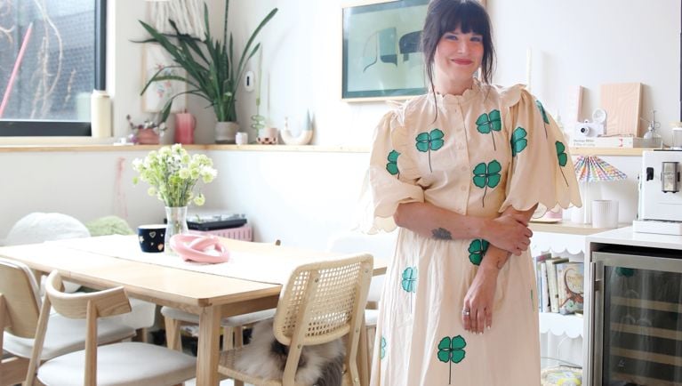 Maca Atencio in her kitchen wearing her whimsical summer style