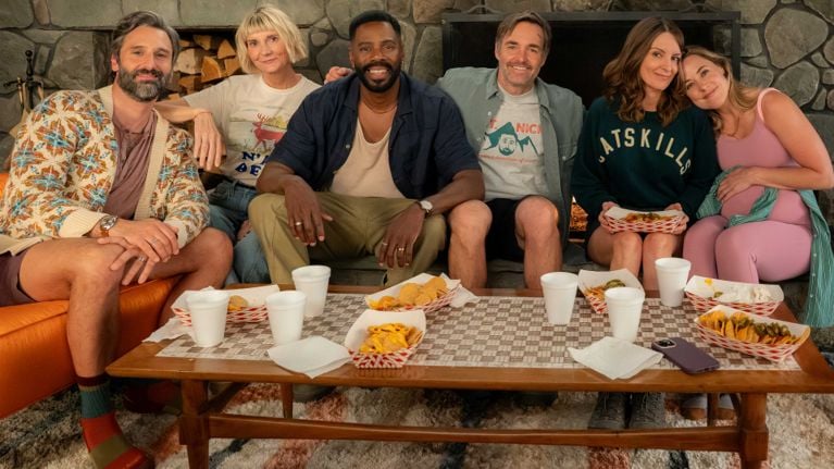 A group of five friend sitting on a couch in front of a fireplace used in a post about The Four Seasons, season two.