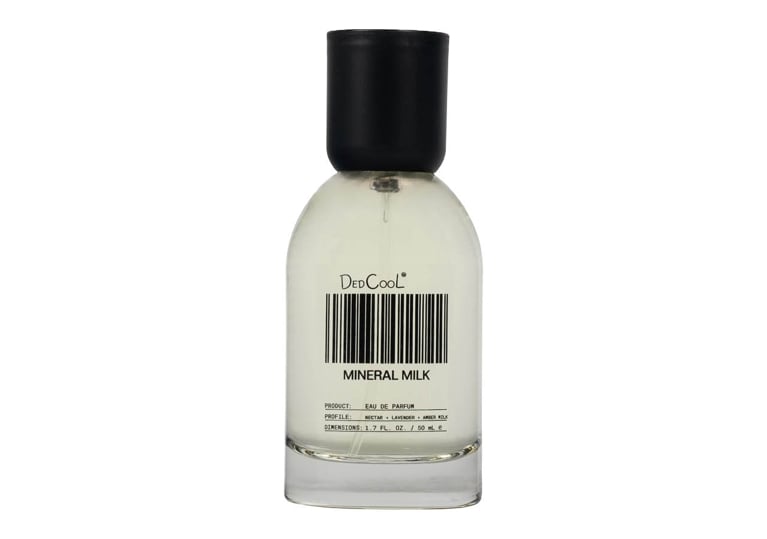 A bottle of DedCool Mineral Milk Eau de Parfum for an article about the best new perfumes for summer 2026.