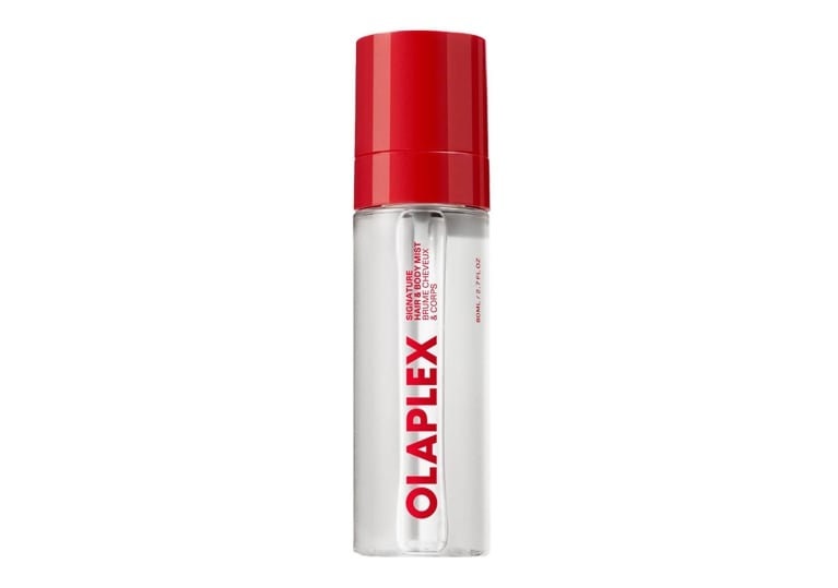A bottle of Olaplex Signature Hair & Body Mist for an article about the best new perfumes for summer 2026.